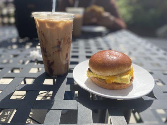 Egg, cheese and bacon on brioche. Mocha iced coffee.