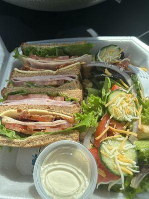 Club sandwich and side salad