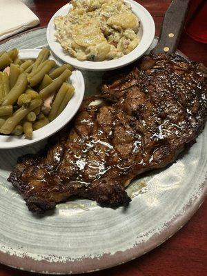 12 oz Ribeye with baked potato salad and green beans