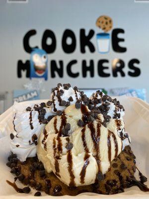 A la mode Chocolate Chip cookie topped with vanilla ice cream and the works