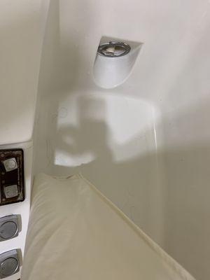 Cracked chrome fixtures on bathtub