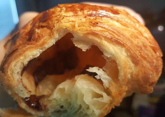 Squeezed open, inside of pain au chocolat purchased on 1/16/21