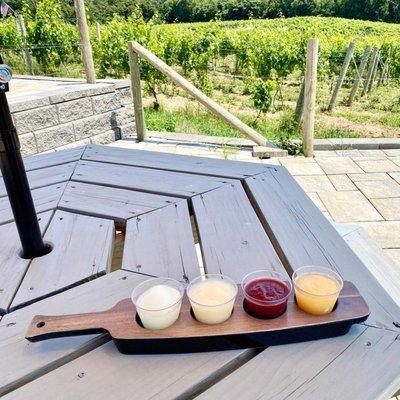 Wine Slushee Flight (vodka-rita, mango pina colada, blackberry & peach)