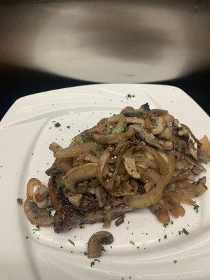 Strip steak with mushrooms and onion