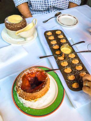 Chocolate soufflé (the best!), another with raspberry sauce, and mini madeleines! So cute and delicious.