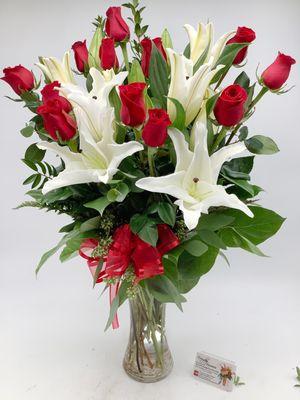 Dozen roses with white lilies by Everyday Flowers