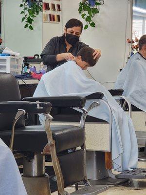 Getting his hair cut ‍