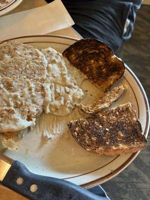 Chicken fried steak with sausage gravy? and burnt wheat toast.