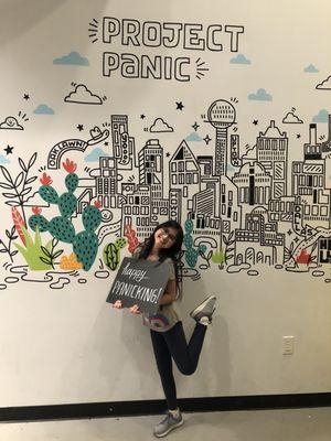 Daughters first escape room ! Posing at the wall of the Project Panic.