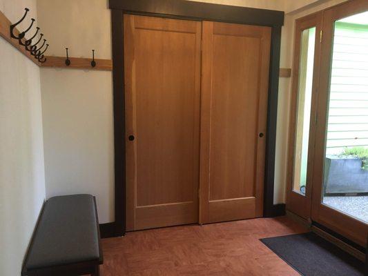 Closet with tables, chairs and yoga supplies in the foyer off of our movement room/ classroom.