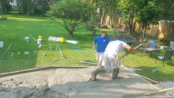 John mucking around in the cement.