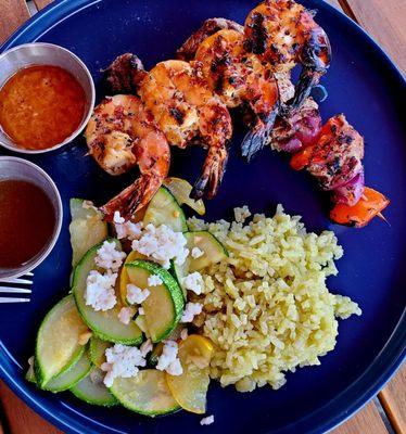 Beautifully cooked beef and shrimp with just right veggie rice and bright tasy squash with feta.