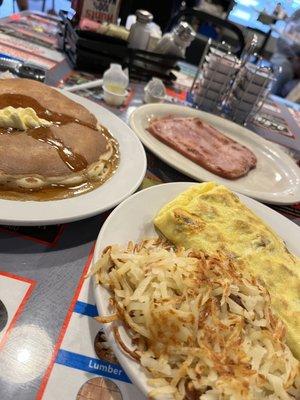 Breakfast. All meats omelette with hash browns and a side ham and hot cake. All good.