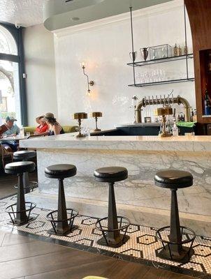 Bar with leather bar stools