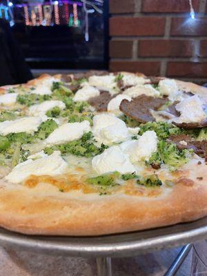 White pie: ricotta, mozzarella, broccoli, sausage. We'll definitely order this again!