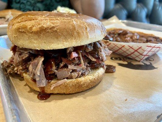 Chopped brisket sandwich with a side of beans. Delish!