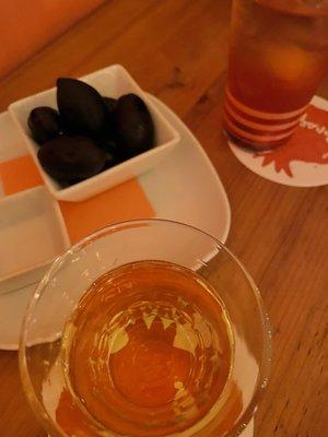 Olives from Puglia , wine and an herbal spritz!