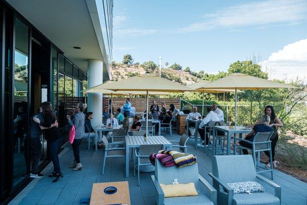 H.G. Fenton Company employees enjoy the patio at our Home Office, with a grill, beer keg, firepit and outdoor games.