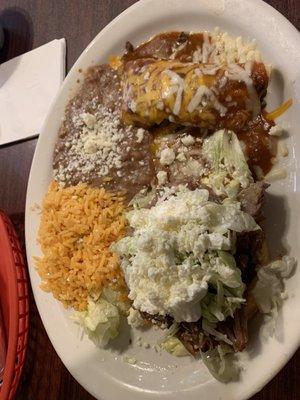 Carnitas Sope and beef enchilada with the typical red rice and beans. This was cold