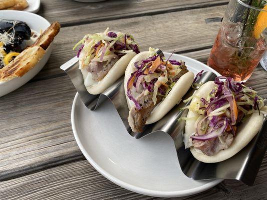 seared ahi tuna bao buns, sesame cured cabbage & heirloom carrot slaw, wasabi-cucumber crema