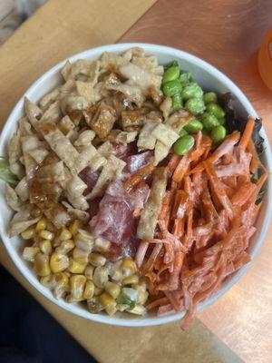 Ahi salad with edamame, carrots, corn slaw, won tons, creamy sesame, and teriyaki sauces