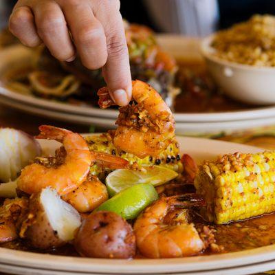 The Famous Mambo Style Shrimp with added corn & potatoes