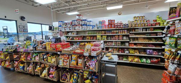 Friendly owner at his duty station & a sampling of the astounding variety of this store.