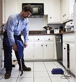 Our plumbing technician using our slab leak detection equipment