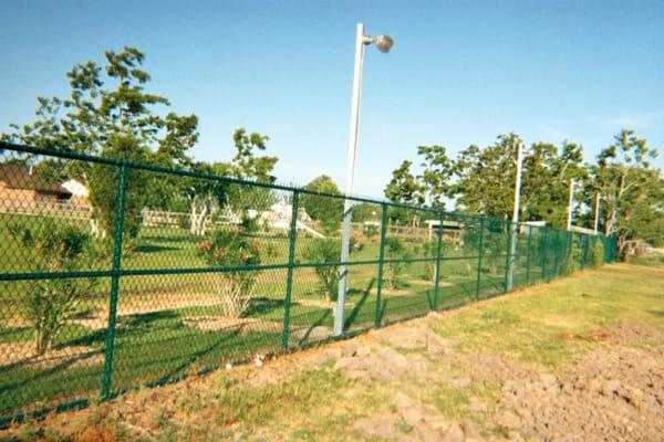 All Vinyl-Coated Chain Link Fencing and Commercial Lighting.