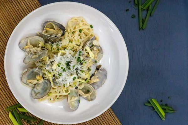 Inspired by the Korean dish Janchi Guksu, this hand-pulled pasta combines a creamy base with tender mussels and a delicate egg garnish