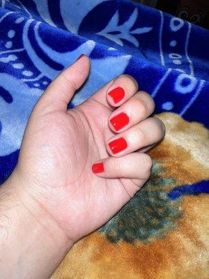 gel manicure in ferrari red