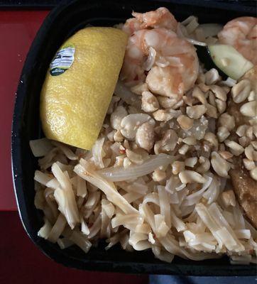 Pad Thai with lemon served with sticker still on it. Noodles were mush too.