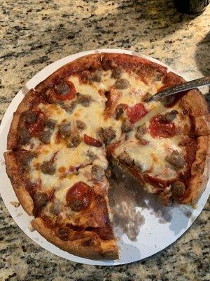 Medium pan with sausage, pepperoni, and extra cheese.