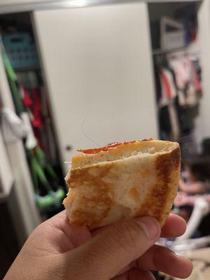 A hair inside our pizza . My daughter was eating this pizza next time wear a damn hair net when making a damn pizza disgusting