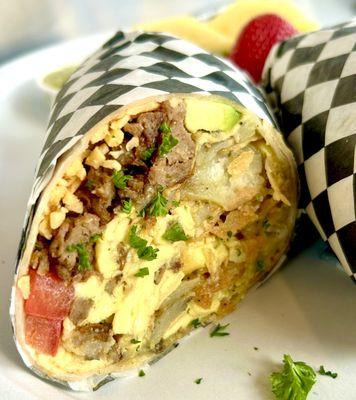 Chilaquiles Burrito with sausage, tomato and avocado!