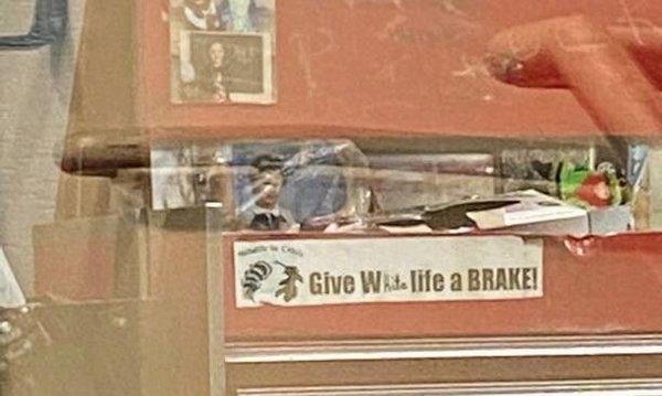 Someone changed the "Give Wildlife a Brake" sticker on their toolbox to "Give White life a Brake".