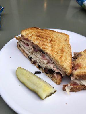 Turkey, cheddar melt with grilled onions and cranberry mayonnaise.