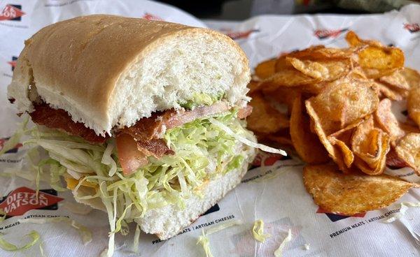 Turkey-Bacon-Avocado + Cheddar with lettuce, tomato, and mayo on a sub roll with BBQ chips