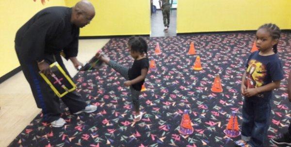 Preschool tiny tigers taekwondo classes executing Front Kicks