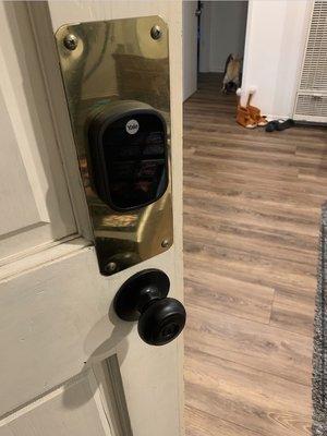 Original keypad that we kept & he removed from the back door (said Yale isn't very reliable) and the new doorknob he installed for us!