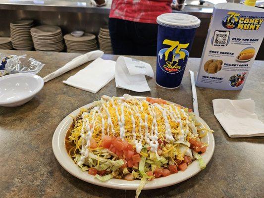 Burrito  smothered in chili and habanero cheese .