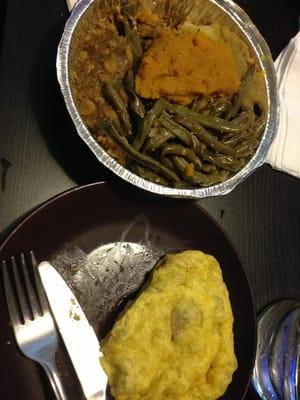 Vegetarian meal with a roti with channa inside.