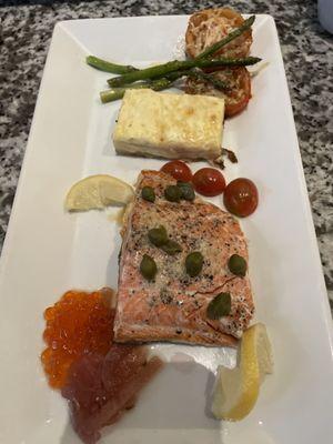 Wild Atlantic Salmon in lemon caper sauce with roe, au gratin potatoes, and roasted vegetables