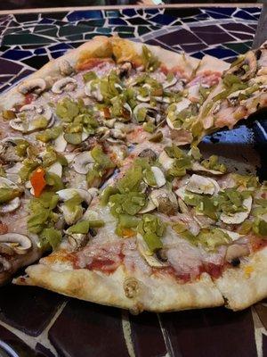 Vegan cheese pizza with hatch green chilis and mushrooms