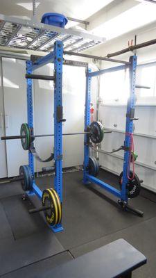 Rogue Equipment: Rack, Olympic Bar and Plates.