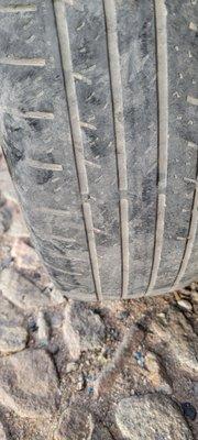 This tire is illegal and should not be on the road.