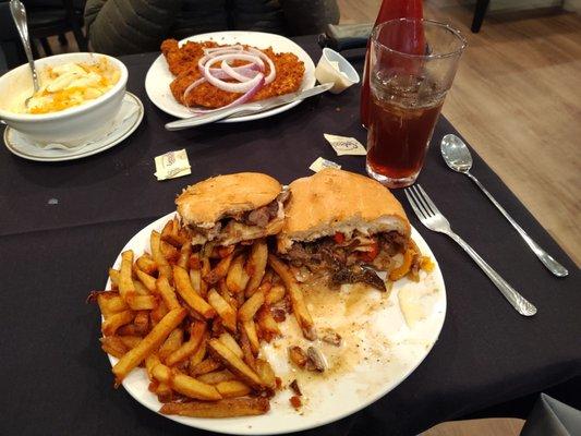 Tenderloin with Mac and cheese. Philly cheese steak with fresh cut fries.