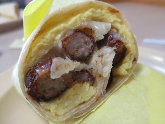 "Breakfast Burrito" -- scrambled eggs, potatoes and large chunks of pork sausage wrapped in a homemade tortilla.