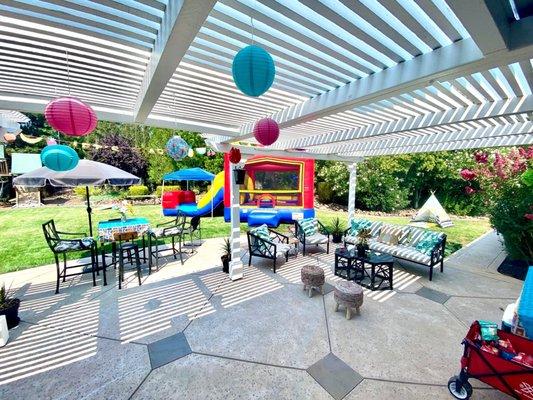 Backyard with rental. Was hot so we put a canopy over the slide pool