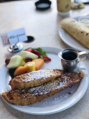 Orange French Toast with side of fresh fruit on the outdoor patio